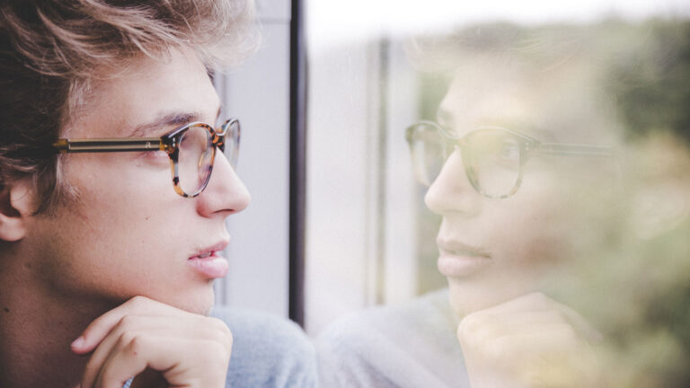 person looking at reflection