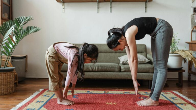 Parent and child doing yoga