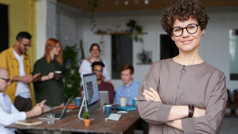 Woman smiling during work meeting.