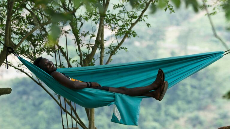 Man relaxing in a hammock.