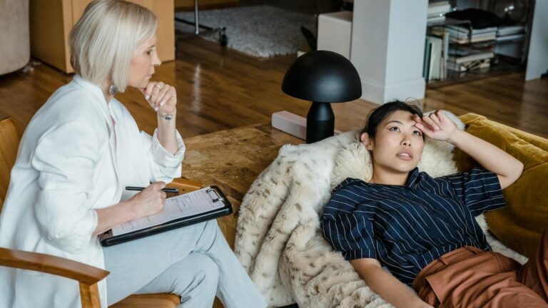 Asian woman speaks in therapy.