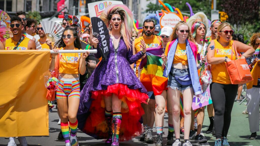 Fashionable man peeks over statue.